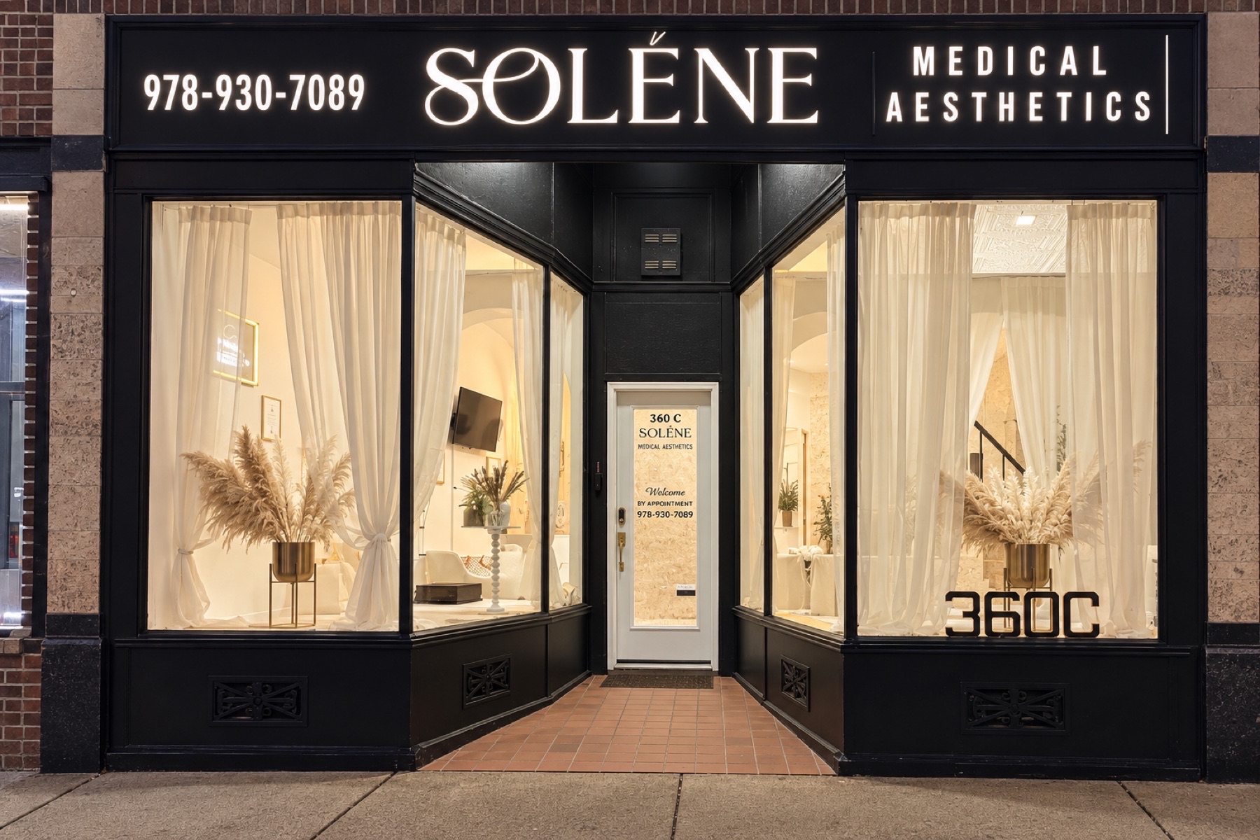 The exterior entrance and illuminated sign of SOLÉNE Medical Aesthetics at 360C Centre Street